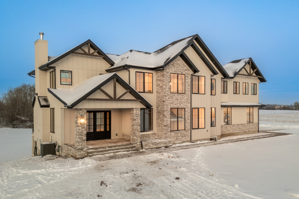 Large custom-built home showcasing premium exterior siding and craftsmanship in Edmonton.